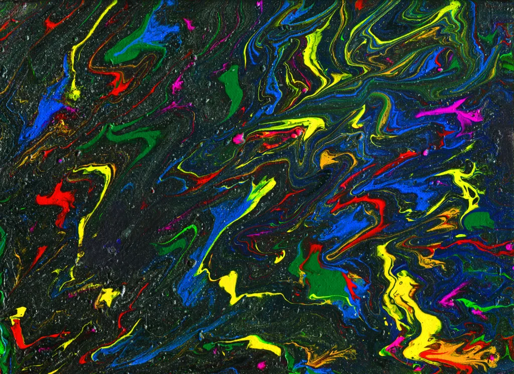 bright swirls of red, blue, and yellow mix with green on a glittering charcoal background