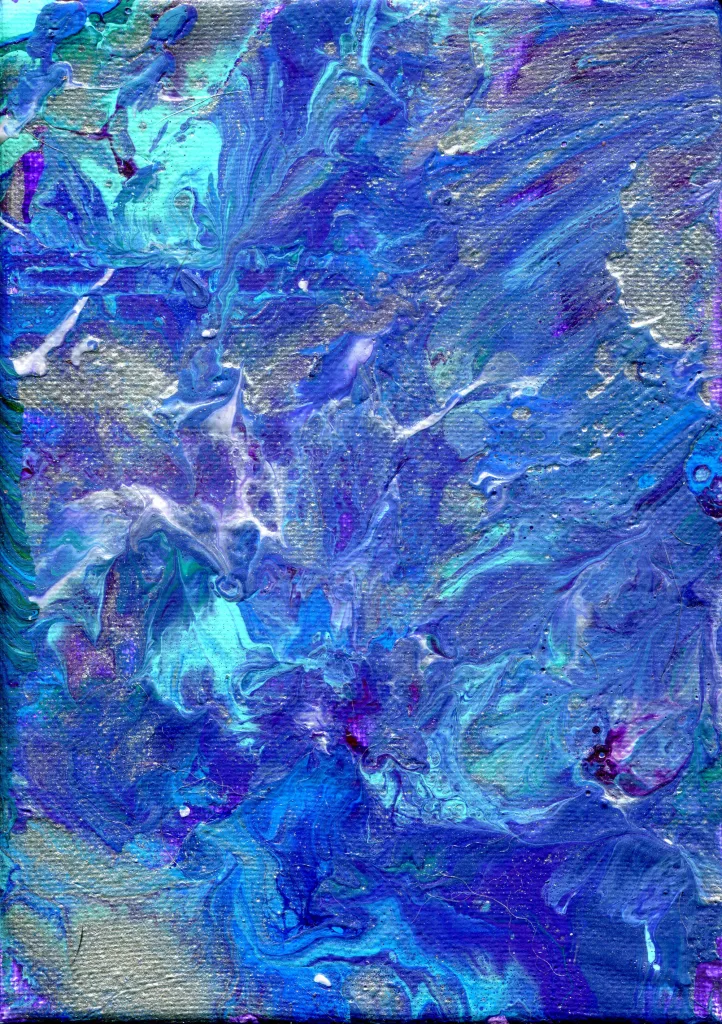 A galaxy of color explodes in shades of blue, red, purple, and silver.