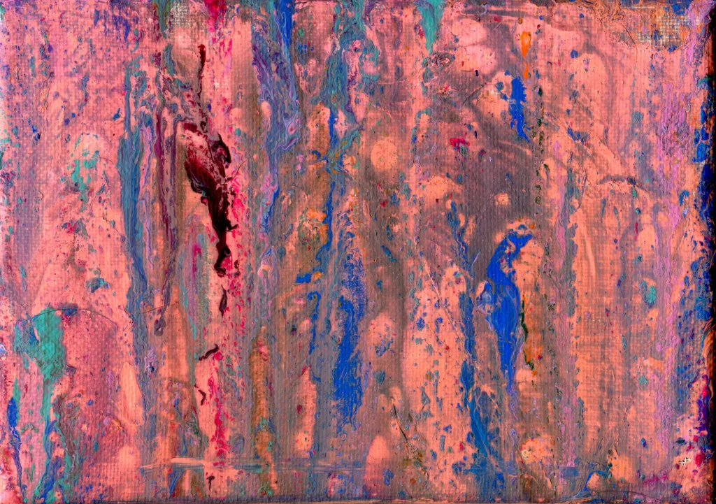 Pink, with a hint of orange, breaks through the shadows like the blush of a sunrise, accented by streaks of teal and blue that resemble Easter ribbons. A splash of dark crimson reminds us of the blood spilled on that hill not so far away.