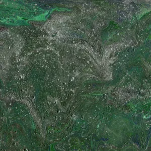 Deep forest green mixes with more vibrant greens and shimmering silvers to create a topography that invokes the heat of summer as the grass grows thick before an inevitable drought.